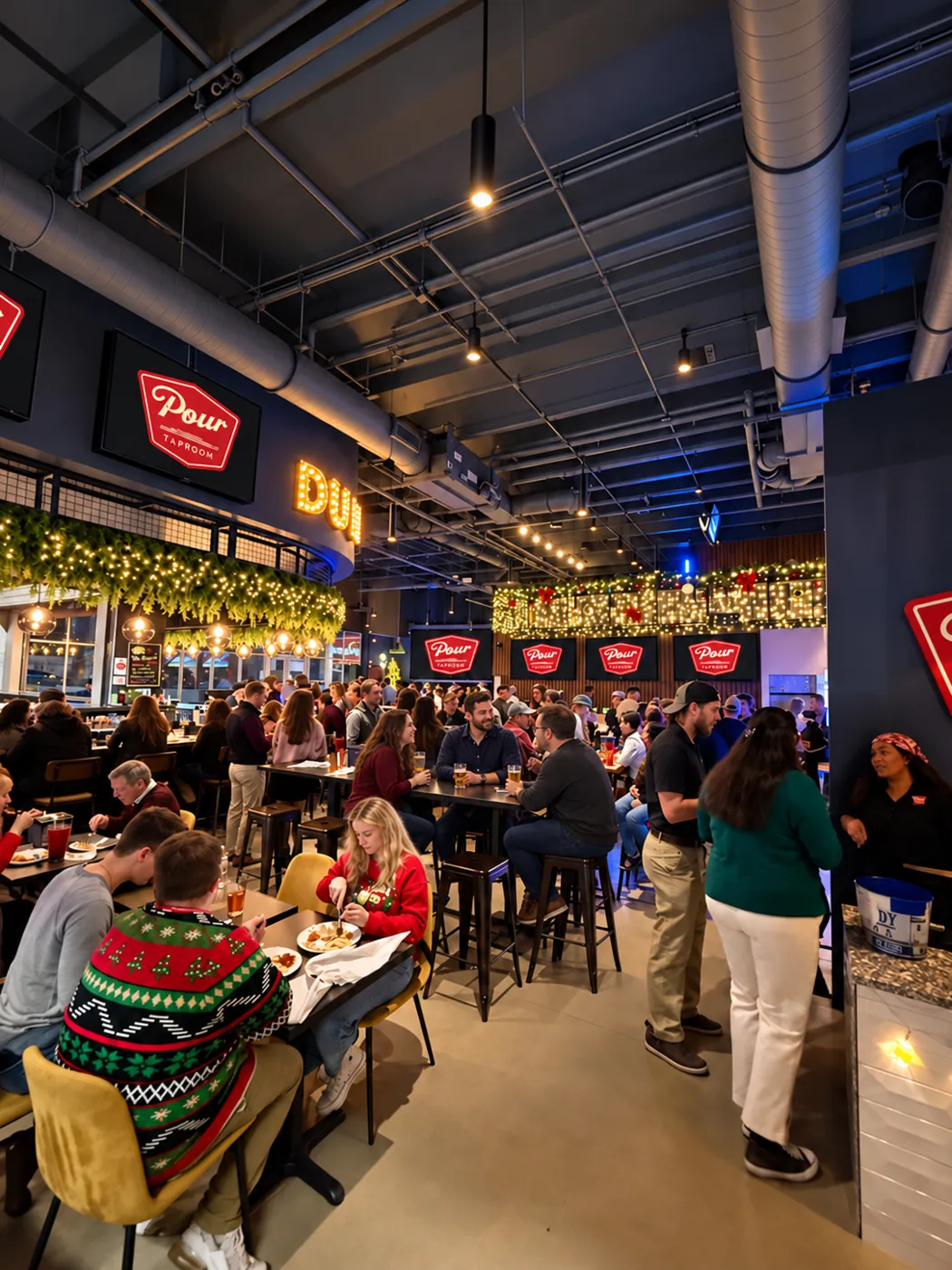 Holiday party crowd under the Duuuval sign at Pour Taproom Jacksonville