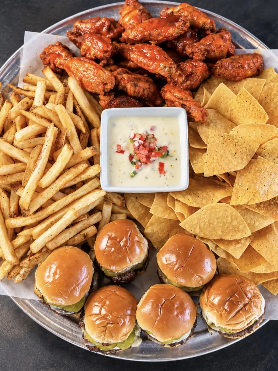 Wings, sliders, fries and queso party platter for events at Pour Taproom Jacksonville